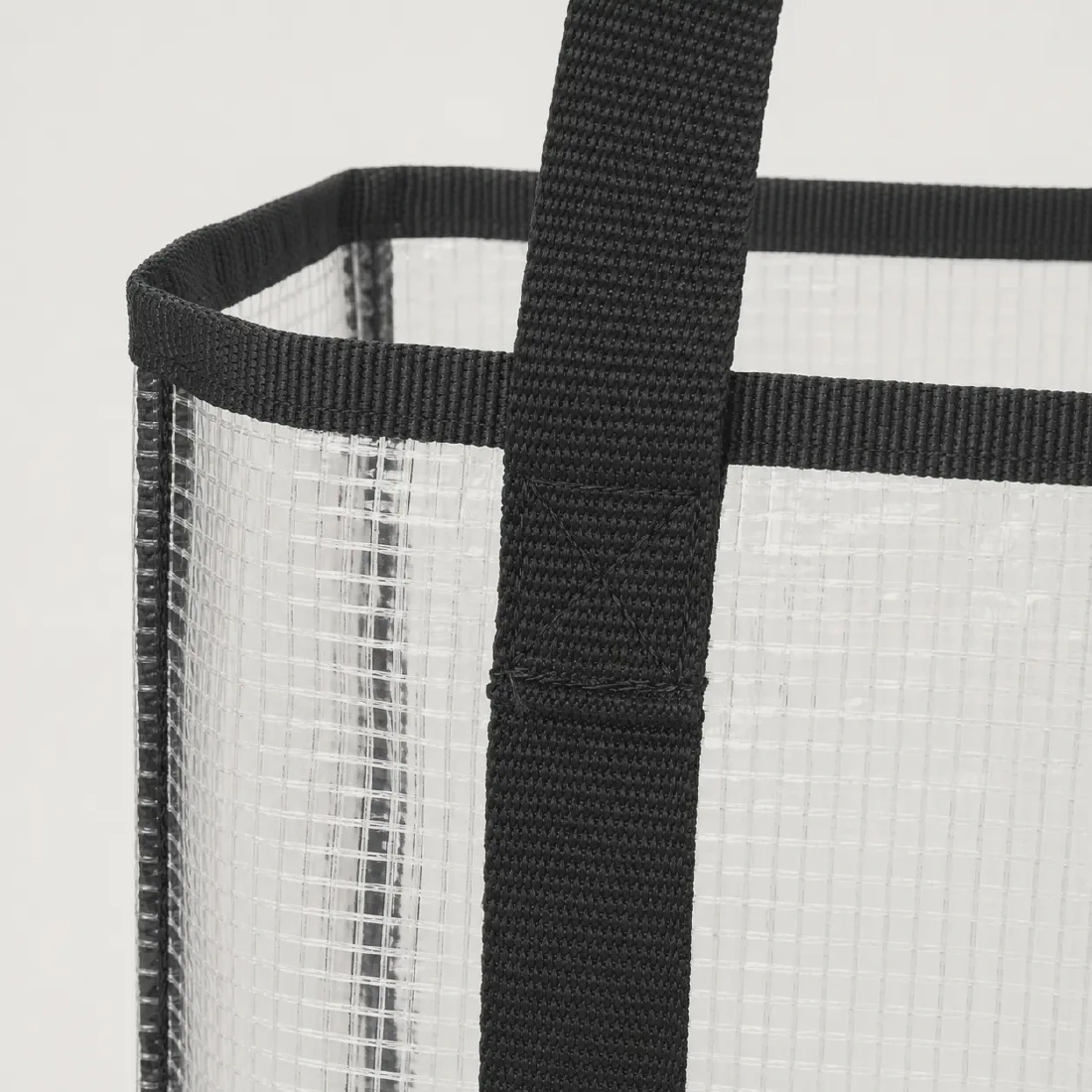 Close-up of black binding and reinforced webbing stitching