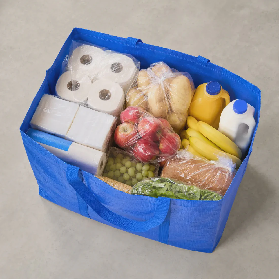 Top view of the extra-large woven tote loaded with bulky groceries