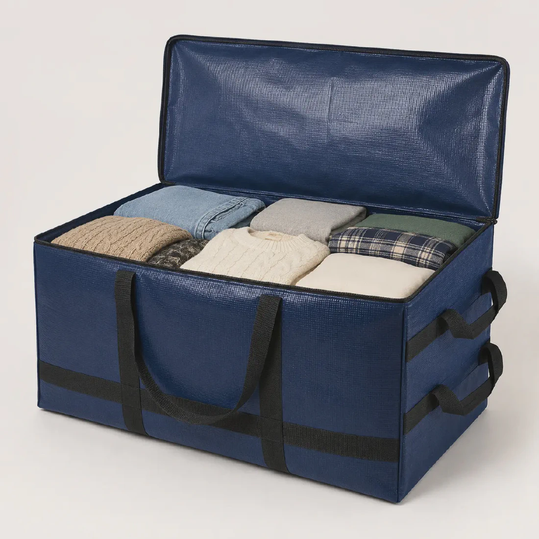 Heavy-duty woven moving bag with its zipper open and clothing loaded